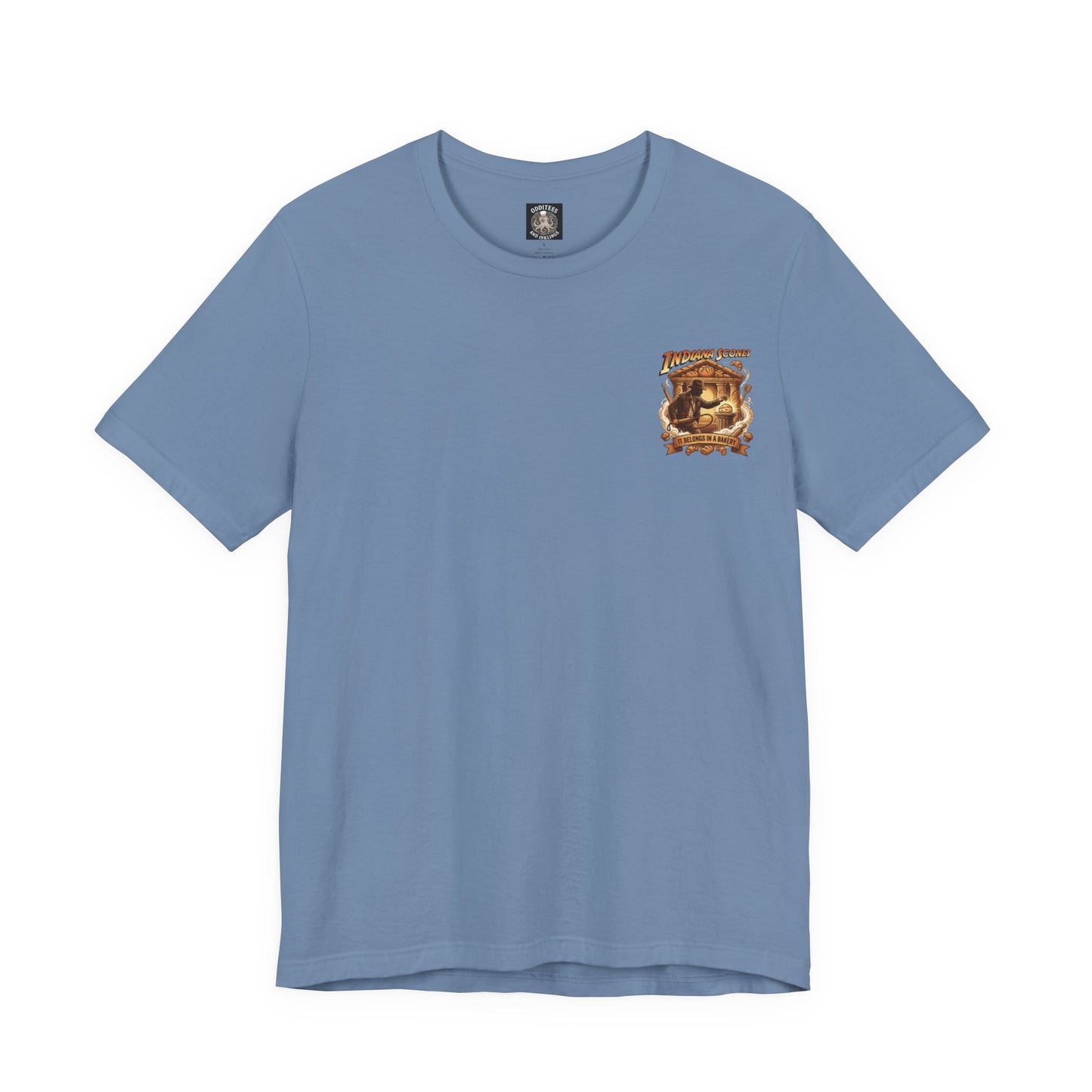 Indiana Scones Bakery Pop-Parody T‑Shirt — "It Belongs in a Bakery" Vintage 80's Adventure Bakery Tee