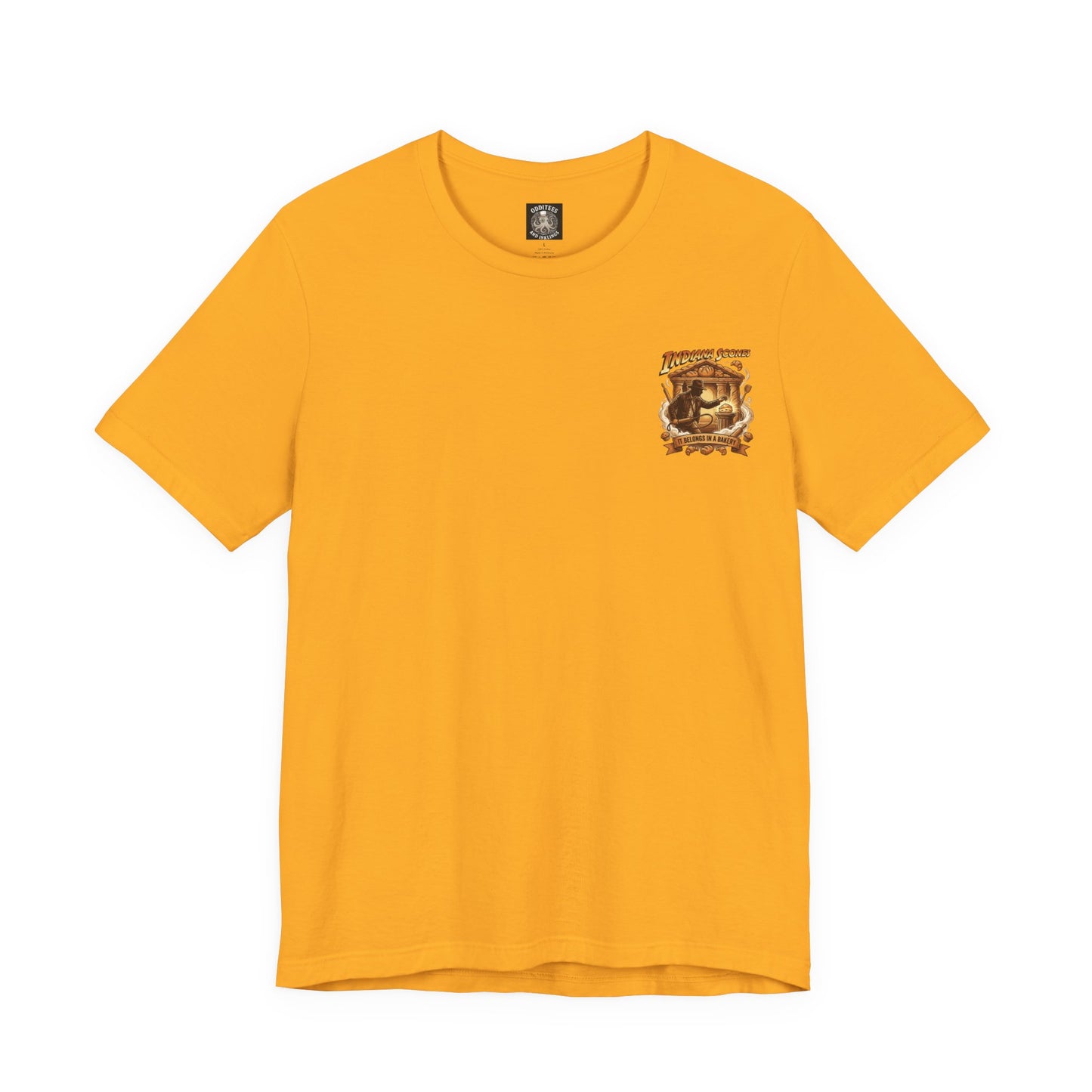 Indiana Scones Bakery Pop-Parody T‑Shirt — "It Belongs in a Bakery" Vintage 80's Adventure Bakery Tee
